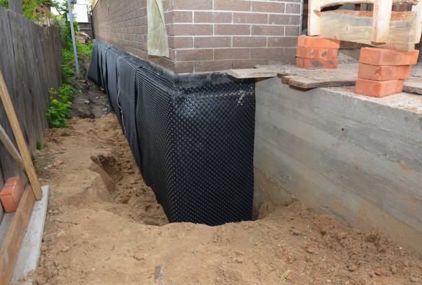 Happy homeowners after waterproofing job in Owens Cross Roads